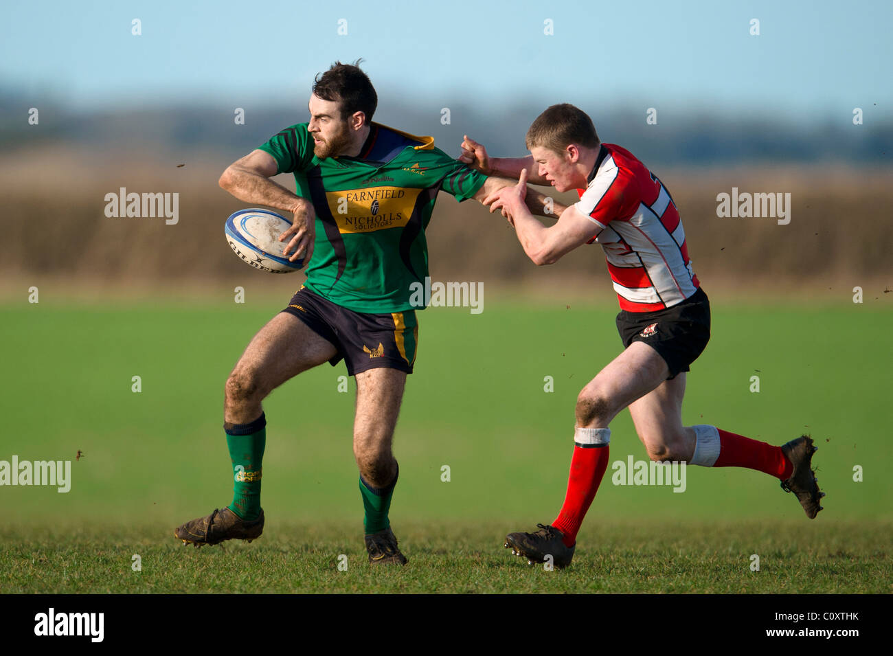 Rugby player being tackled. Stock Photo