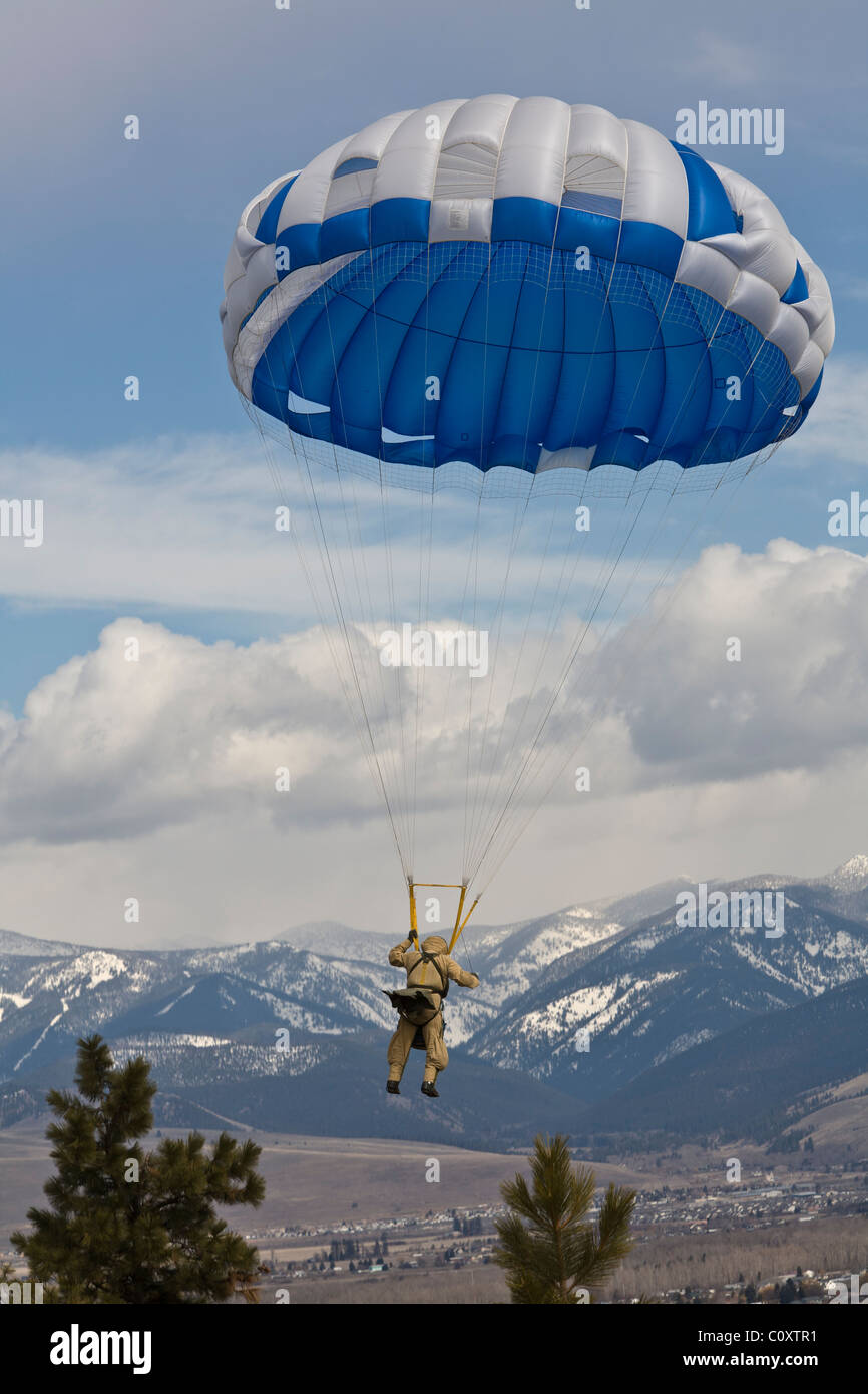 Forest Service smokejumper stationed at the Smokejumper center in Missoula, Montana makes a practice jump. Stock Photo