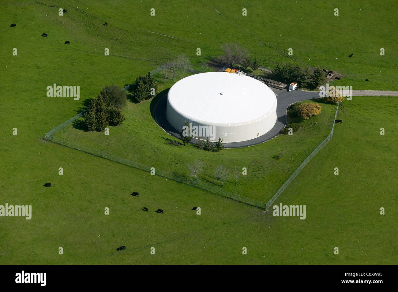 aerial view above large water holding tank pasture Sonoma County California Stock Photo