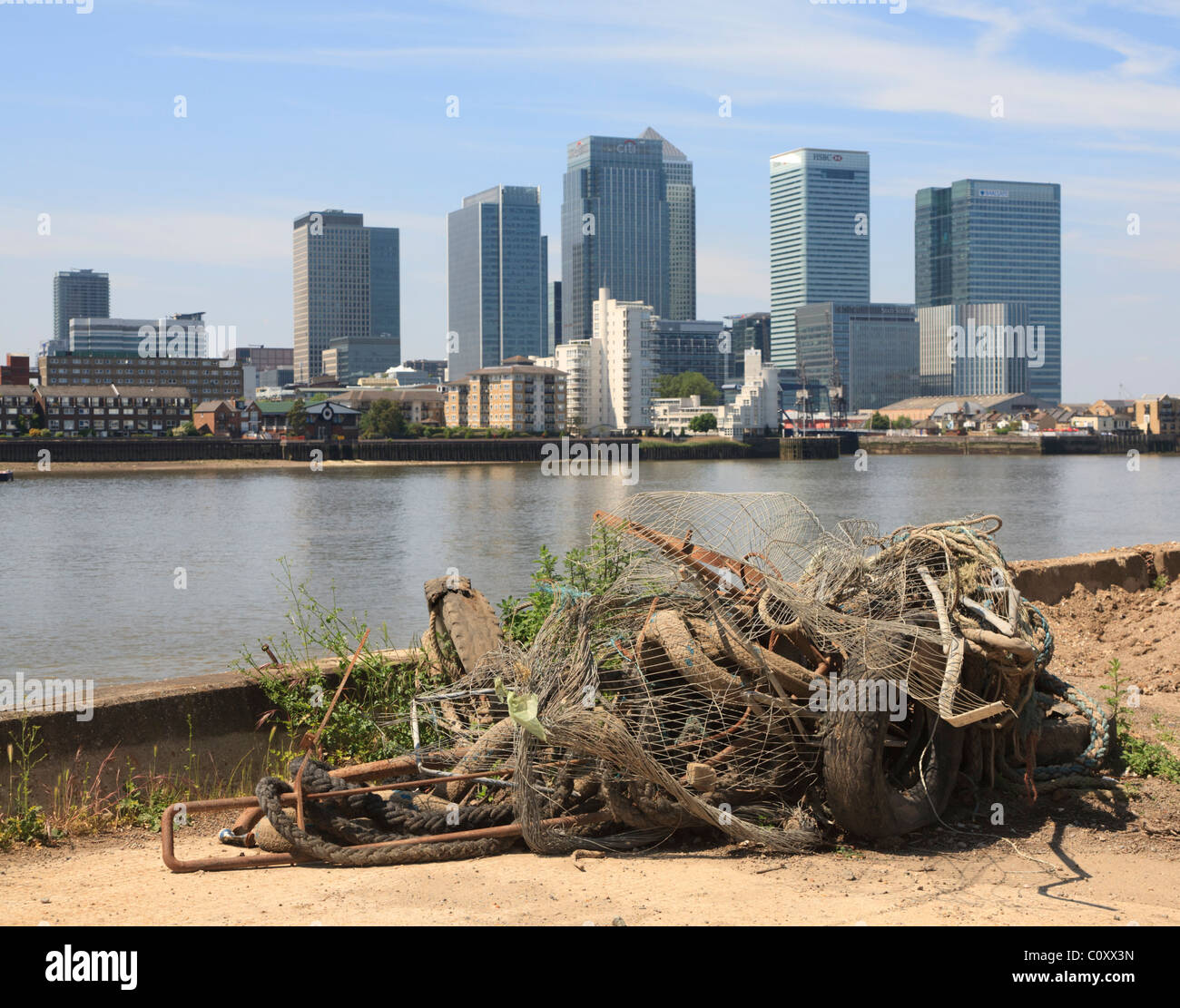 Junk on the Greenwich footpath with the towers of Docklands in the background Stock Photo
