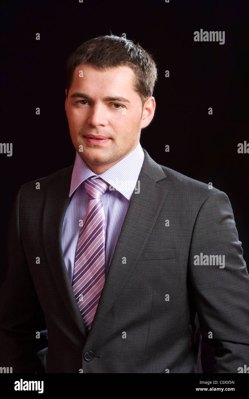 Young business man wearing suit with tie Stock Photo - Alamy