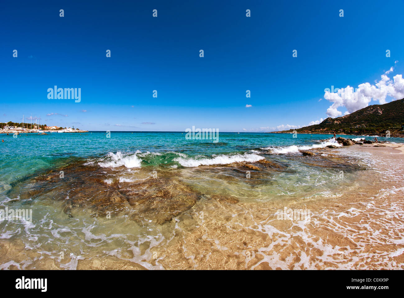 Crystal Waters of Corsica Coast in France Stock Photo