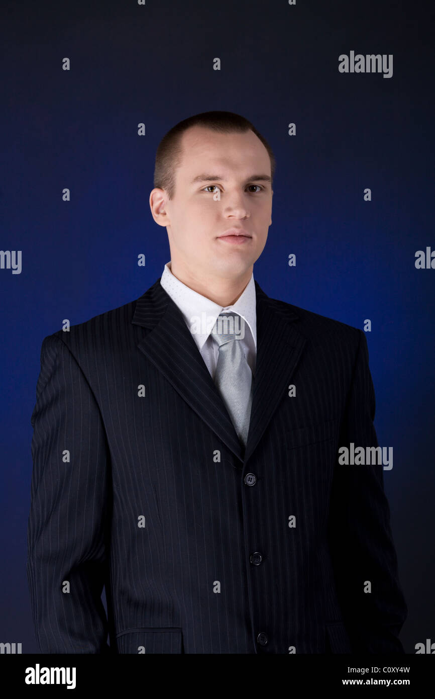 Young business man wearing suit with tie Stock Photo - Alamy