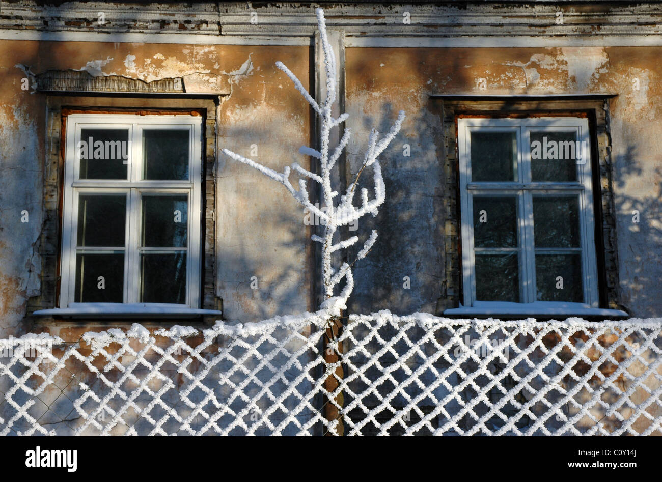 aged window at cottage house at winter Stock Photo