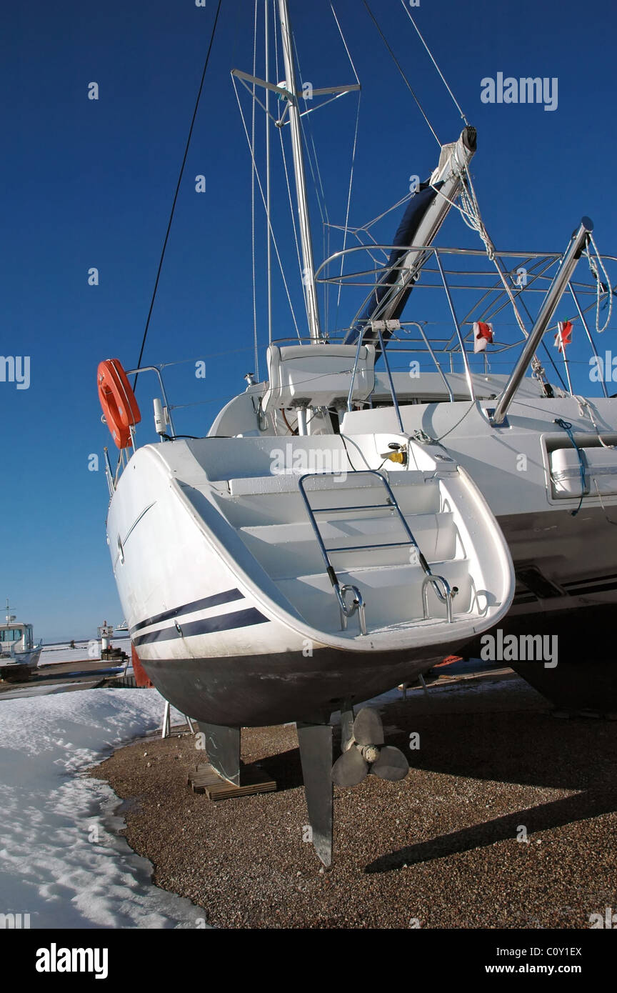 yacht in small frozen harbor in Orjaku, Kassari, Hiiumaa, Estonia at winter Stock Photo