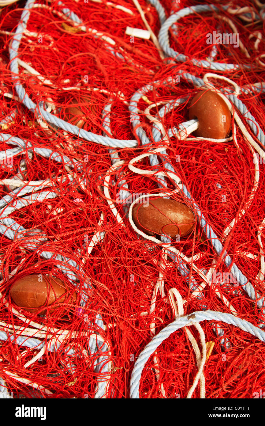 Red Fishing Net in a Port of Corsica, France Stock Photo