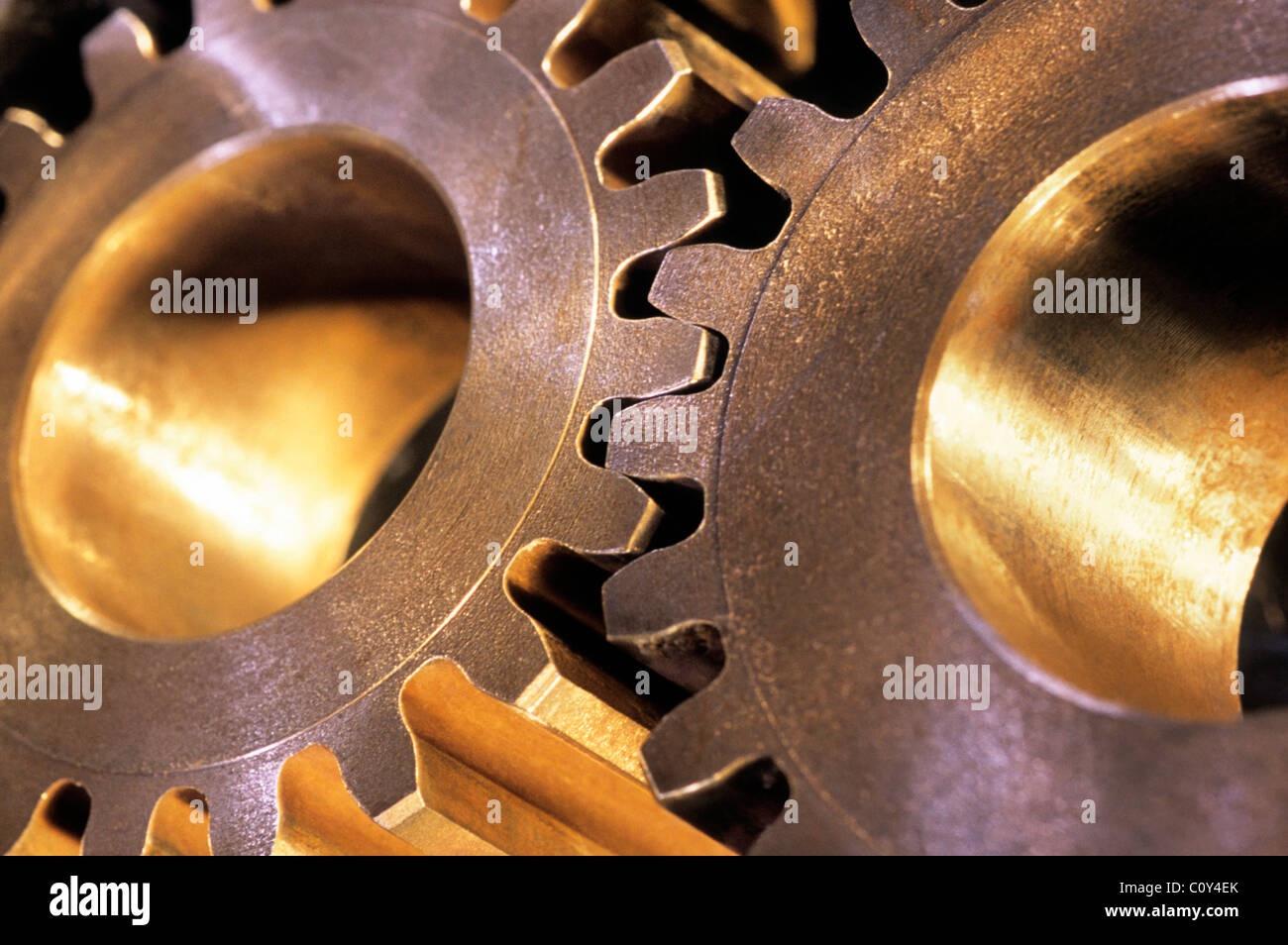 Mechanical gears, gear, cogs, cog. Spur gears. Heavy industrial machinery joined, interlocked, working together. Automation components close up detail Stock Photo