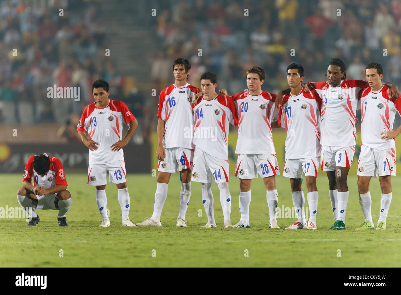 Costa Rican players react to a missed penalty kick against Hungary during the 2009 FIFA U-20 World Cup third place match. Stock Photo