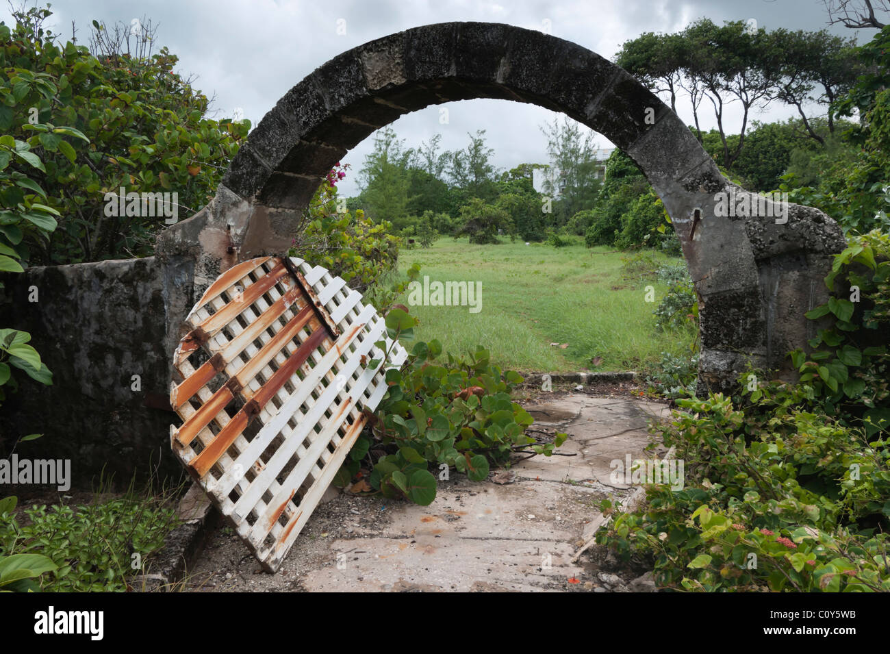 The dereliction of a once-famous hotel - Sam Lord's Castle, Barbados, and its luxury grounds reclaimed by nature Stock Photo