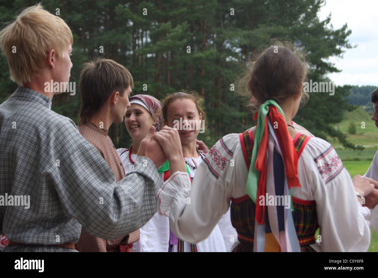 Girls and boys dance round dance at folklore festival Stock Photo