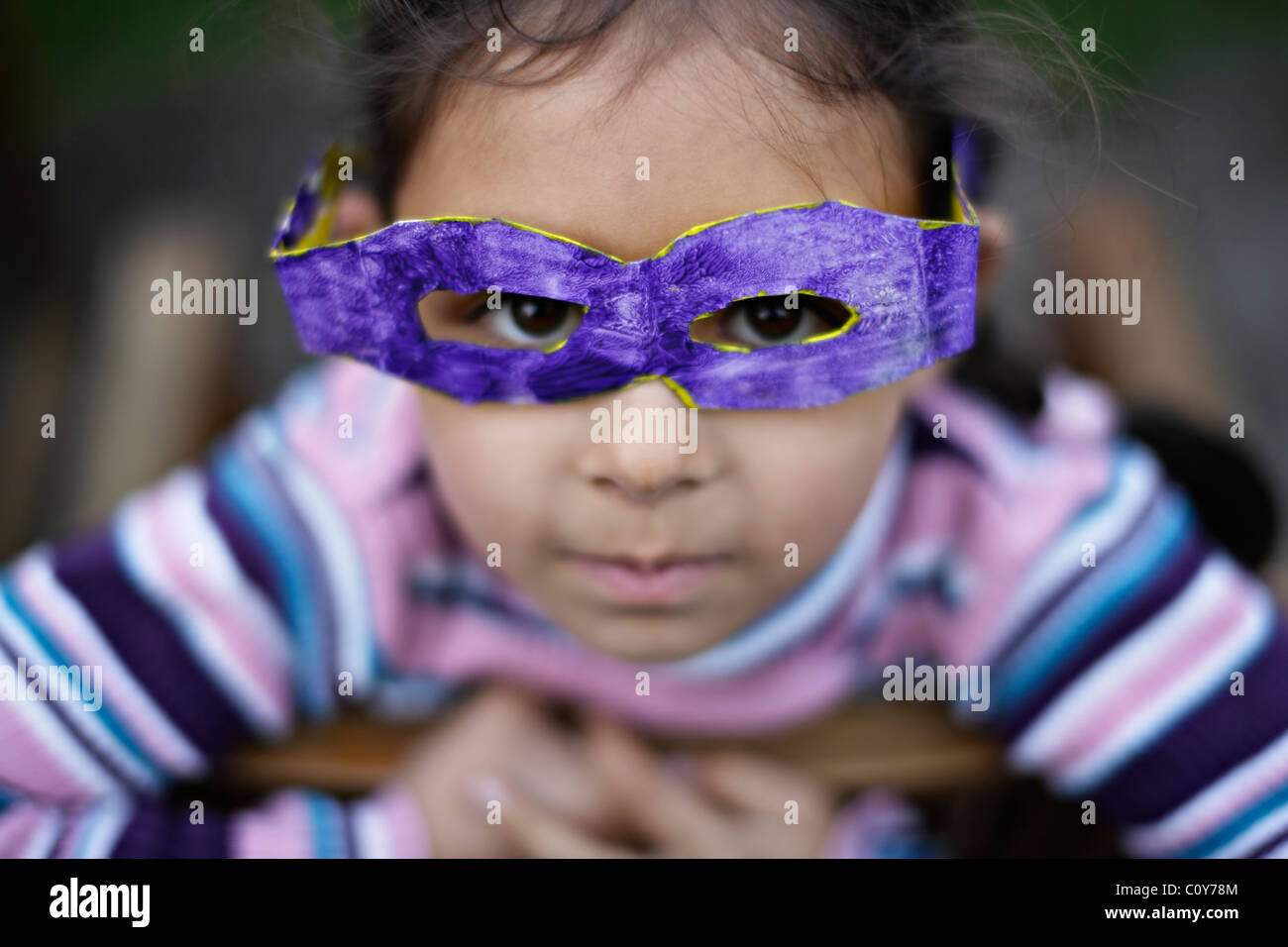 Girl with her cardboard goggles which she made at school Stock Photo