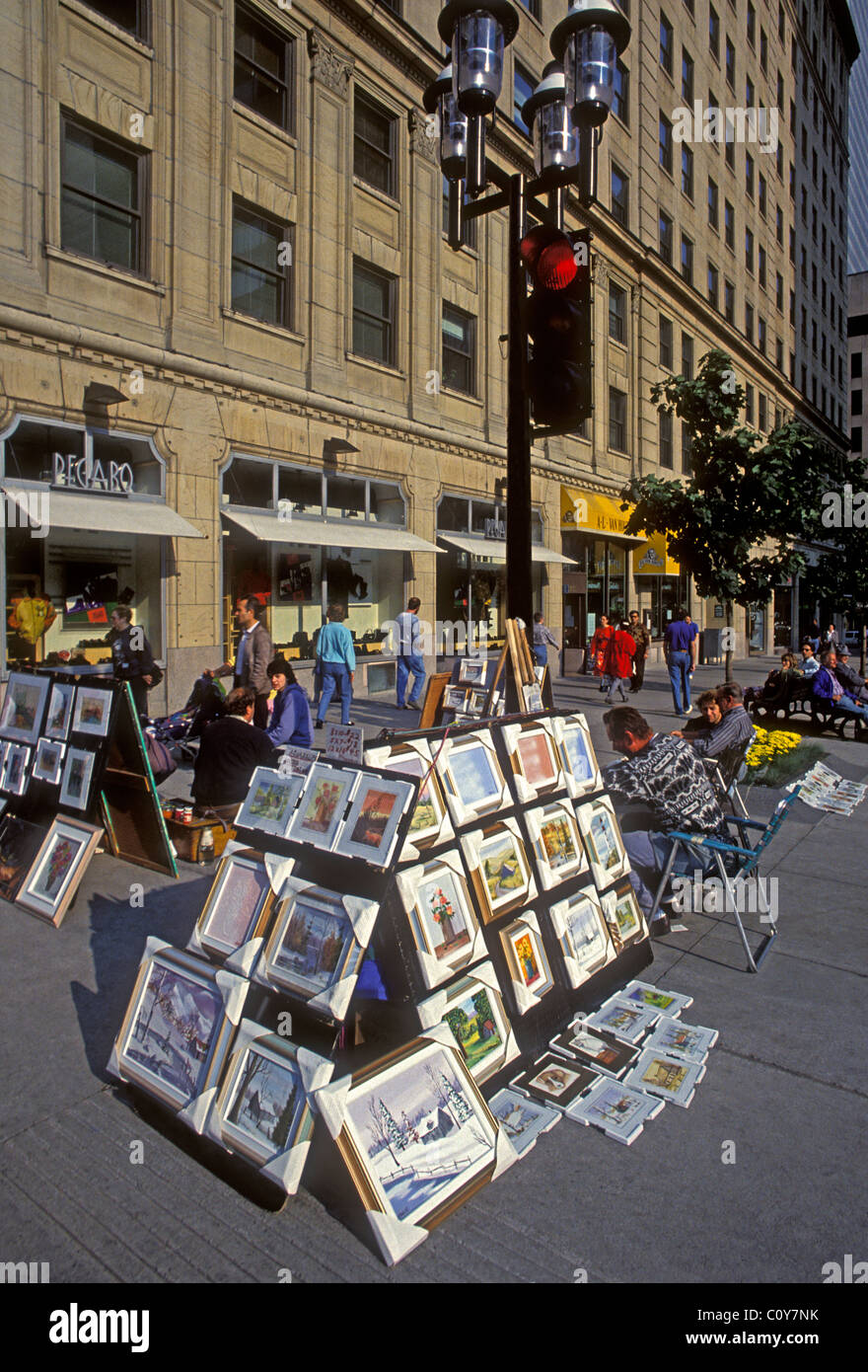 Street vendor artist selling artwork along McGill College Avenue in the city of Montreal Quebec Province Canada North America Stock Photo