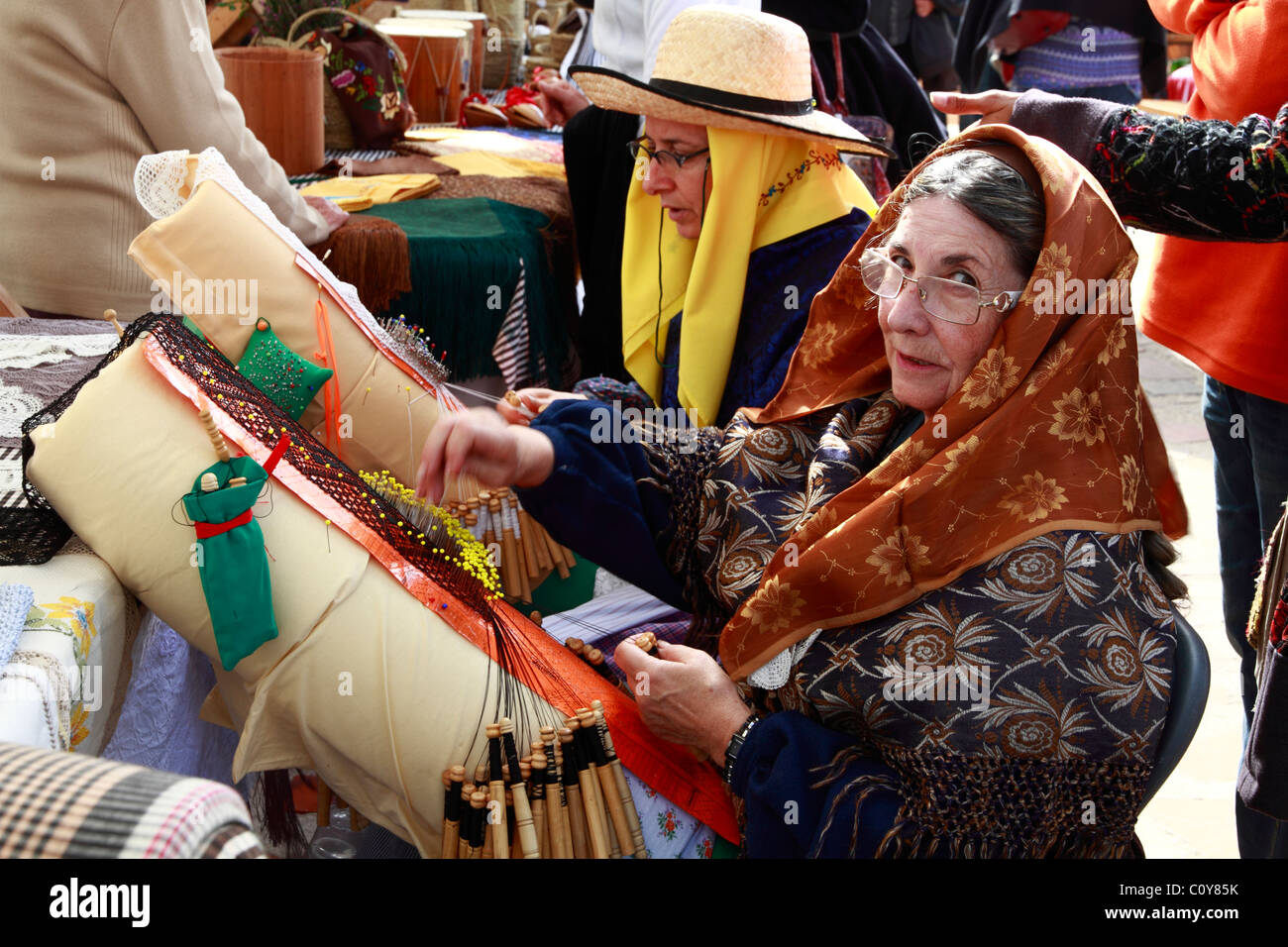 Elderly lades in traditional costume embroidering at a Handicraft Fair, Ibiza, Spain Stock Photo