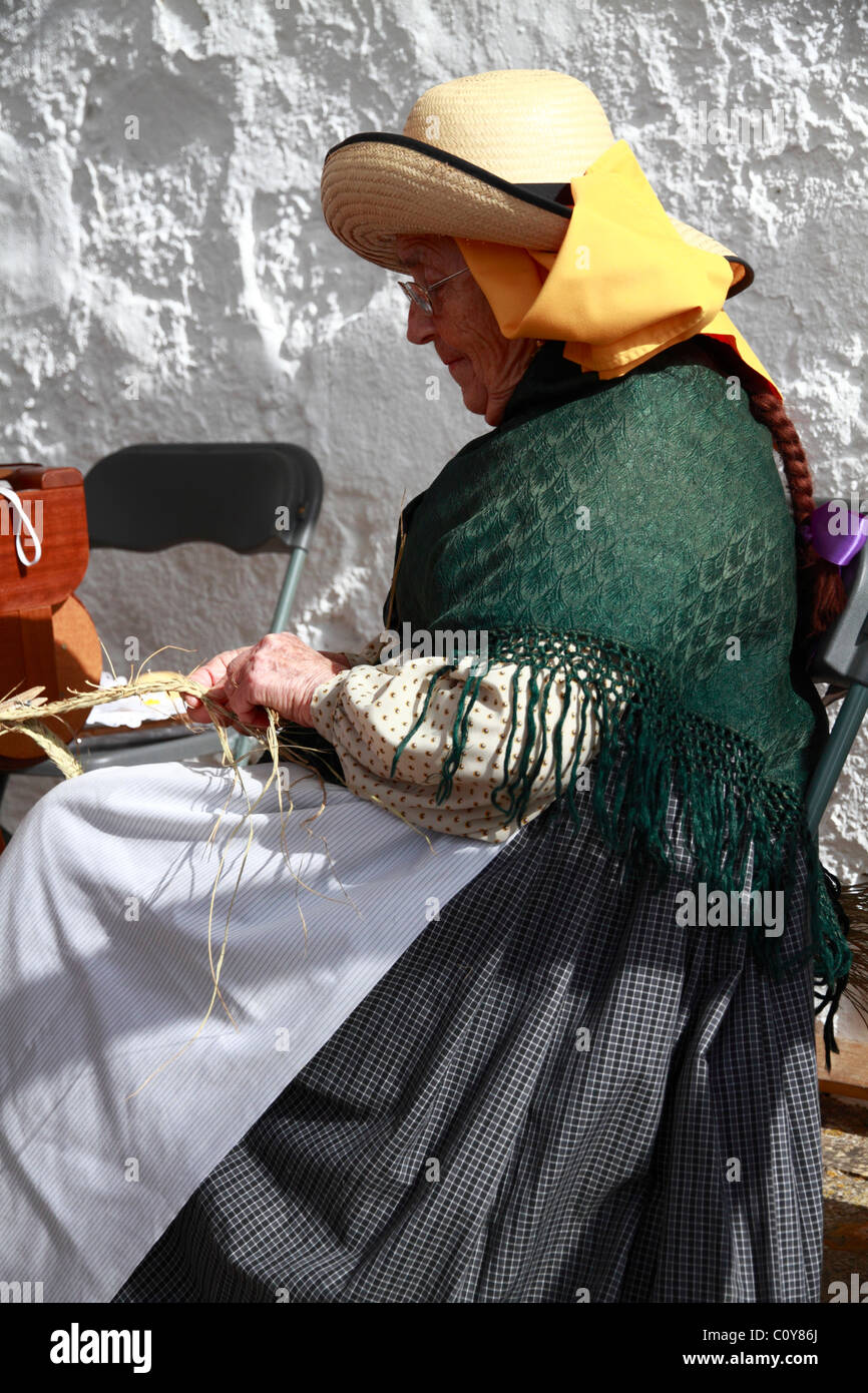Elderly lady in traditional costume at a Handicraft Fair, Ibiza, Spain Stock Photo