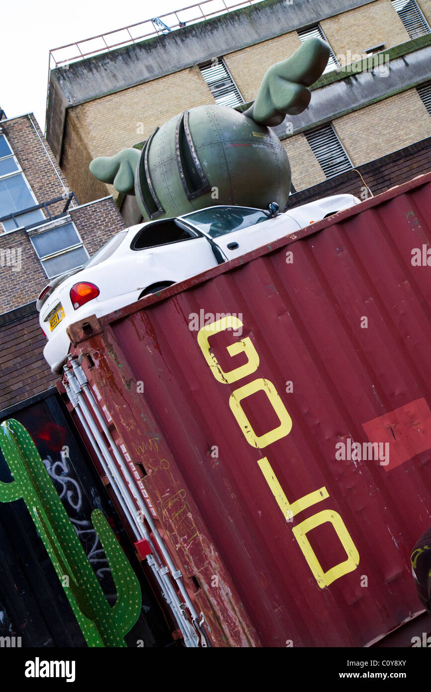 An urban sculpture installation on a shipping container by Street Artist D*Face near Brick Lane in the East End of London, UK. Stock Photo