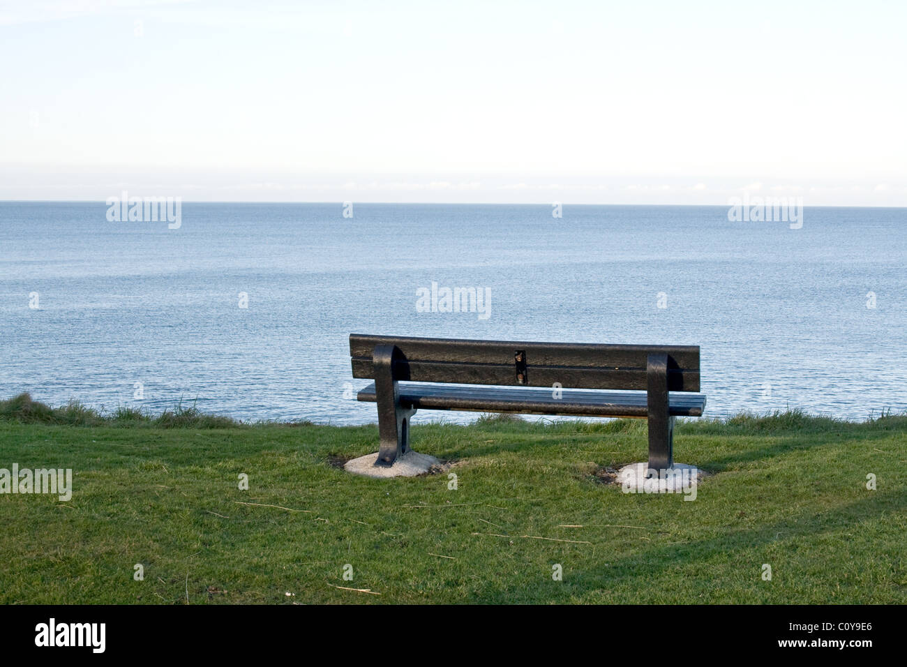 Empty bench overlooking the Moray Firth in Buckie Scotland Stock Photo