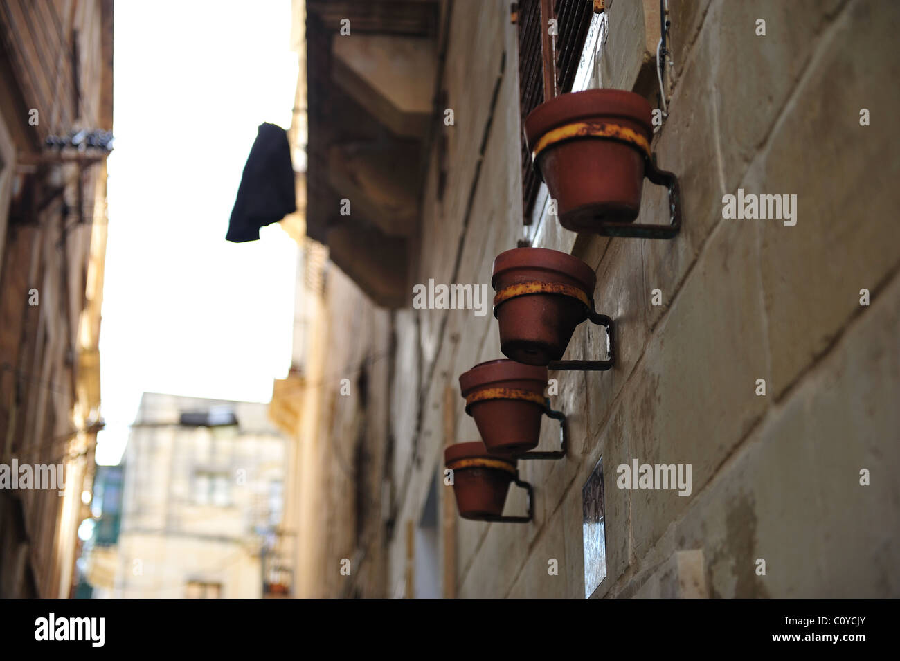 Pots hanging on a wall Stock Photo Alamy