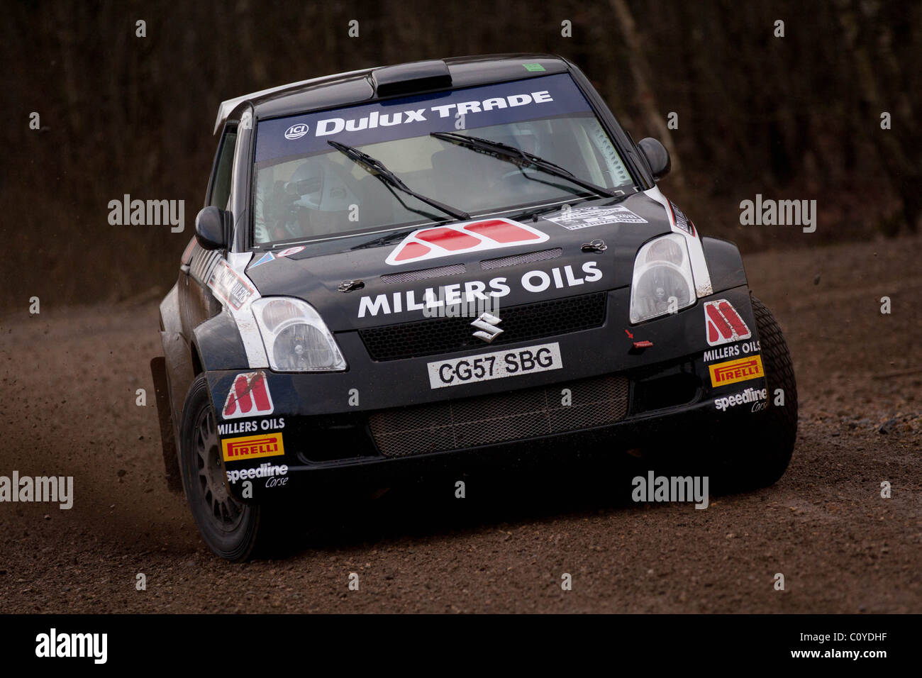 Callum Black black Suzuki Swift Rally Car running through Wareham Forest at the Bournemouth