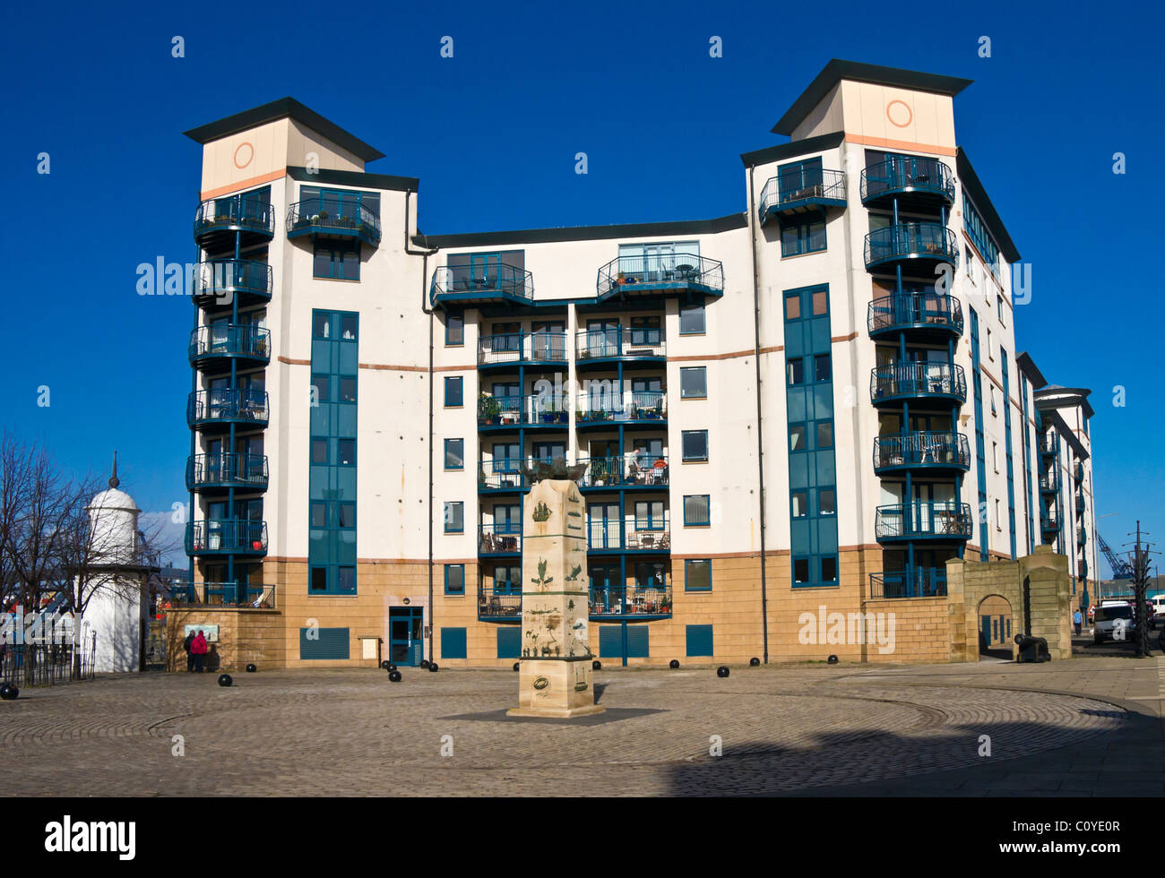Apartment building and lighthouse (left) &The Merchant Navy Memorial on