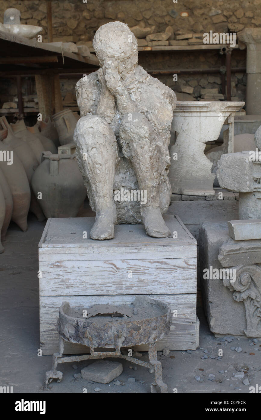 A plaster cast of a man in his last moments. Pompeii, Italy Stock Photo