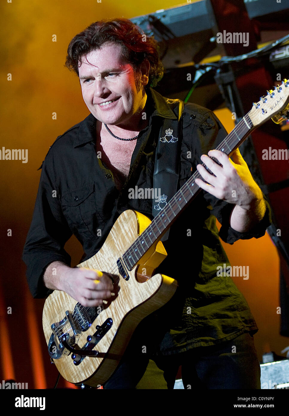 Charlie Burchill of Simple Minds performing on the first night of their "30th Anniversary Tour