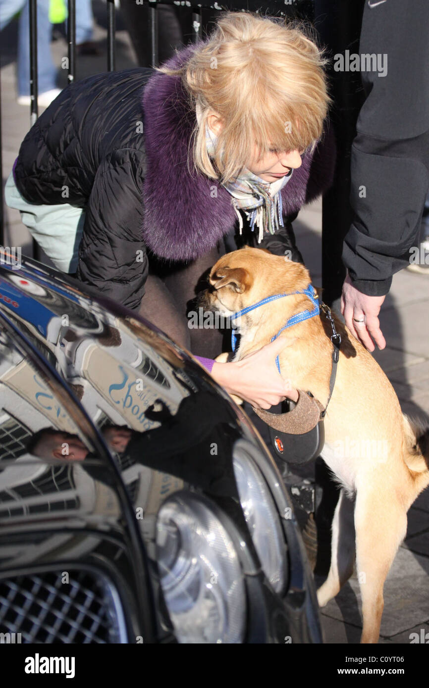 Ekaterina Ivanova take their dog with with them to visit a pet shop ...