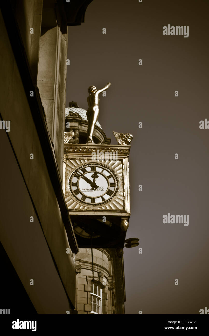 Toned image of ornate vintage art deco clock and statue. Stock Photo