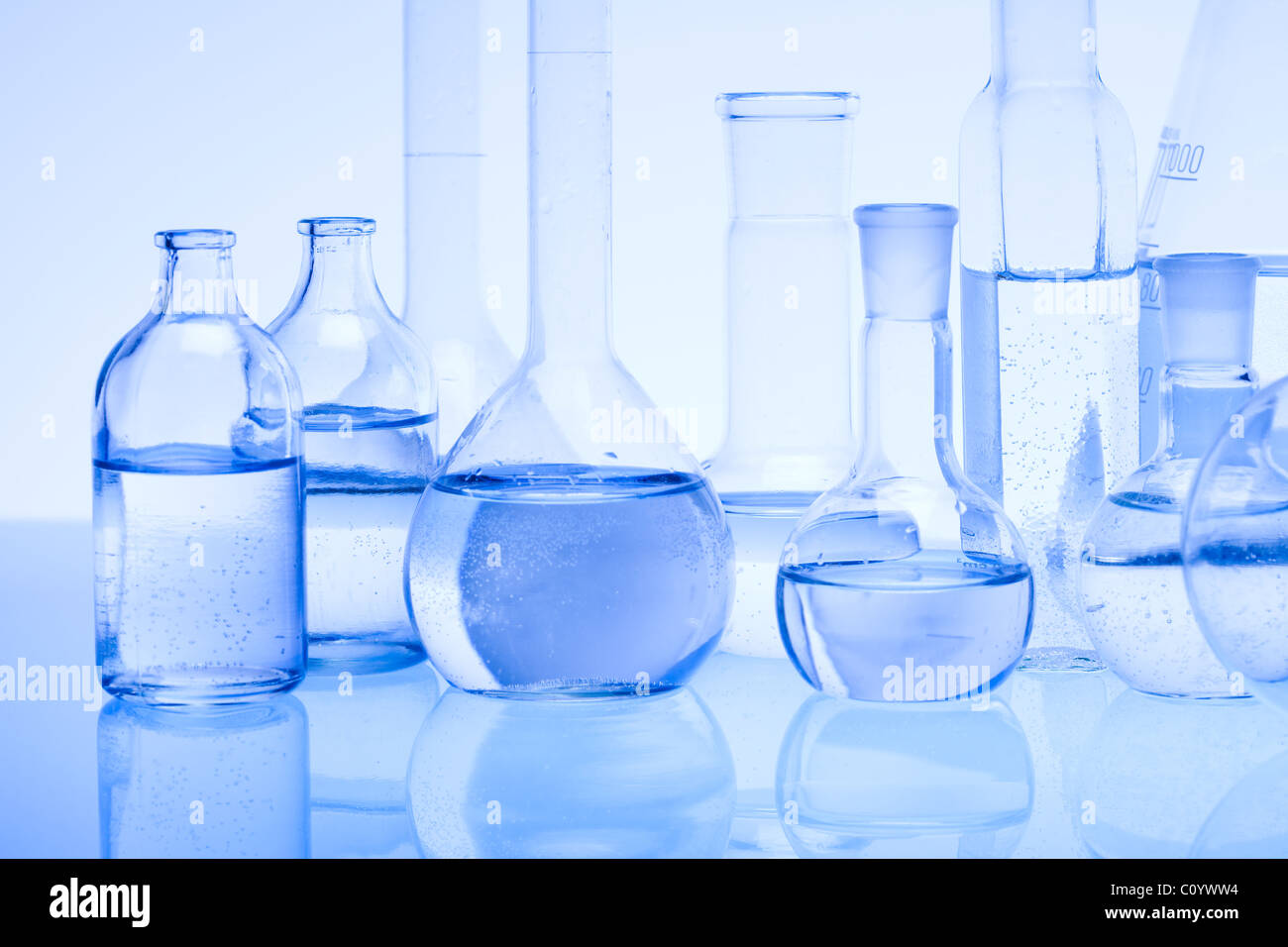 Laboratory glass over blue background Stock Photo - Alamy