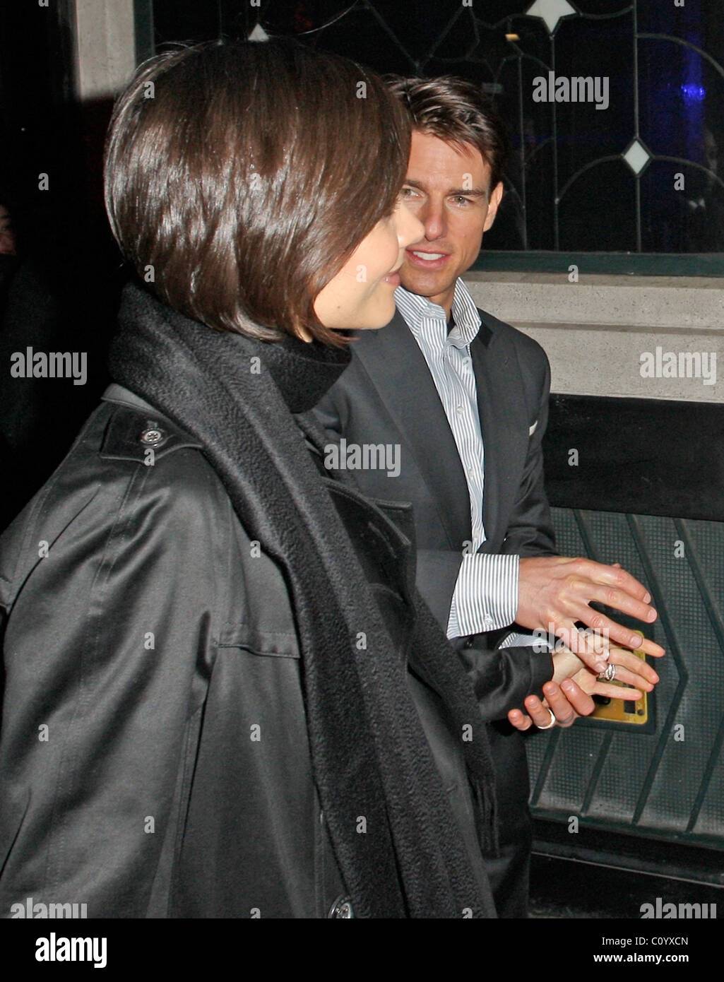 Tom Cruise and his wife Katie Holmes leave The Ivy restaurant, having spent over 2 hours dining inside. The pair smiled and Stock Photo