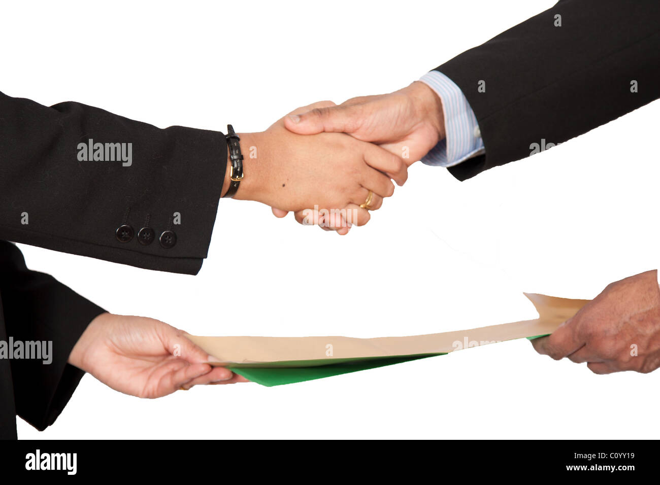 Exchange of a legal document/signed contract with a hand shake Stock