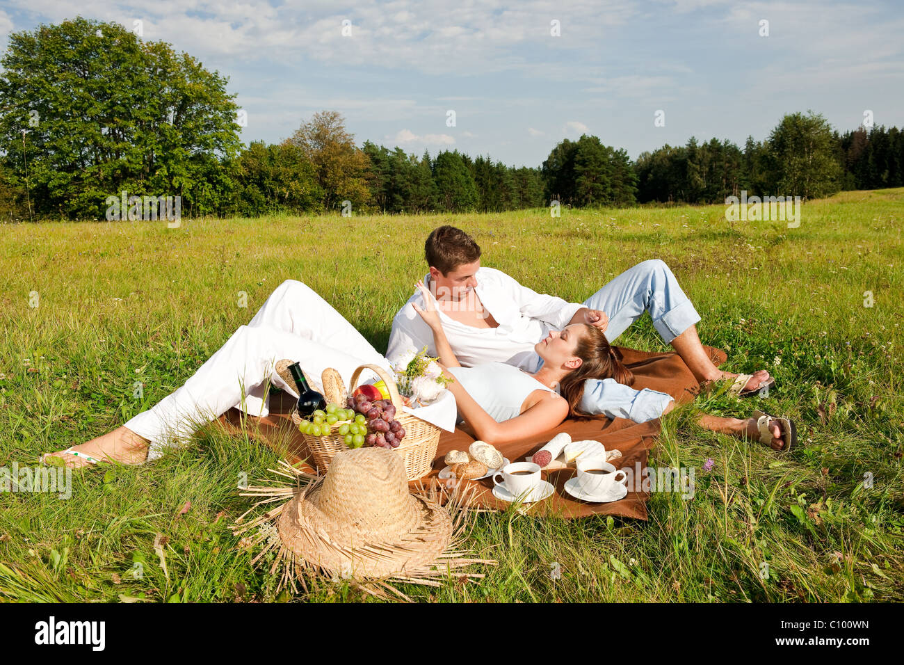Picnic - Romantic couple in spring nature on sunny day Stock Photo - Alamy