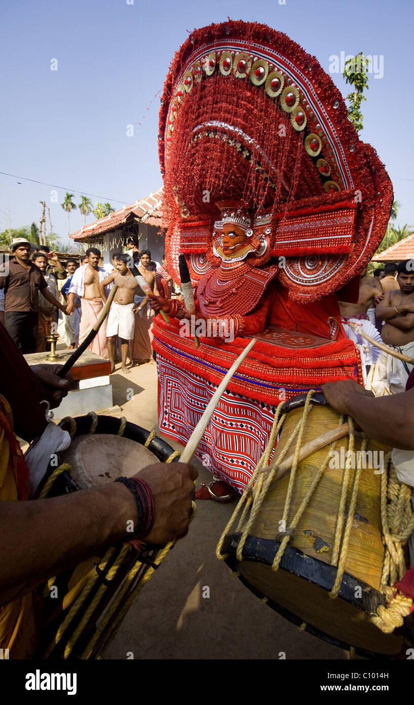 Theyyam the human gods of Malabar dancing with tunes of drums, during a ...