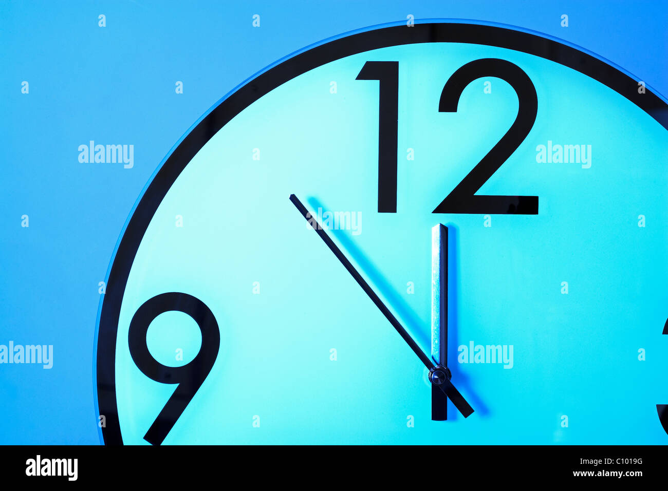 Clock face showing 5 minutes to 12 o'clock Stock Photo