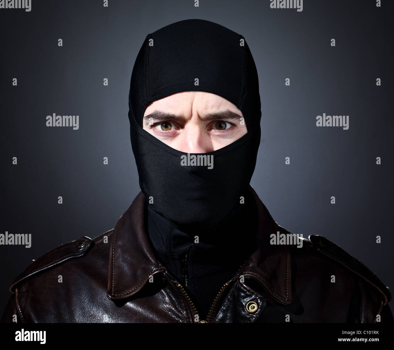 closeup portrait of caucasian criminal with balaclava Stock Photo