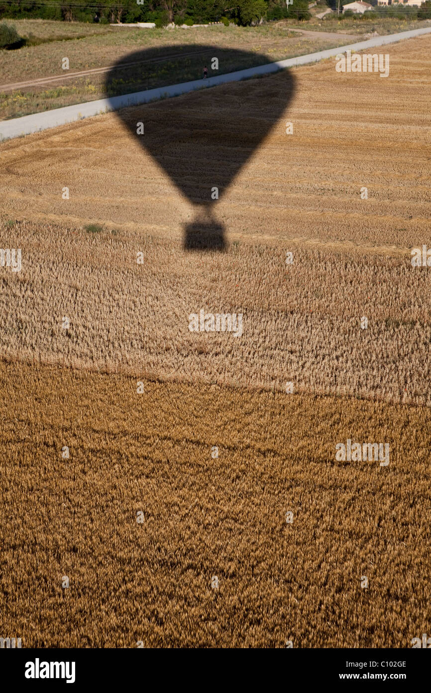 Shadow of a hot air balloon flying over Segovia fields (Spain) Stock Photo