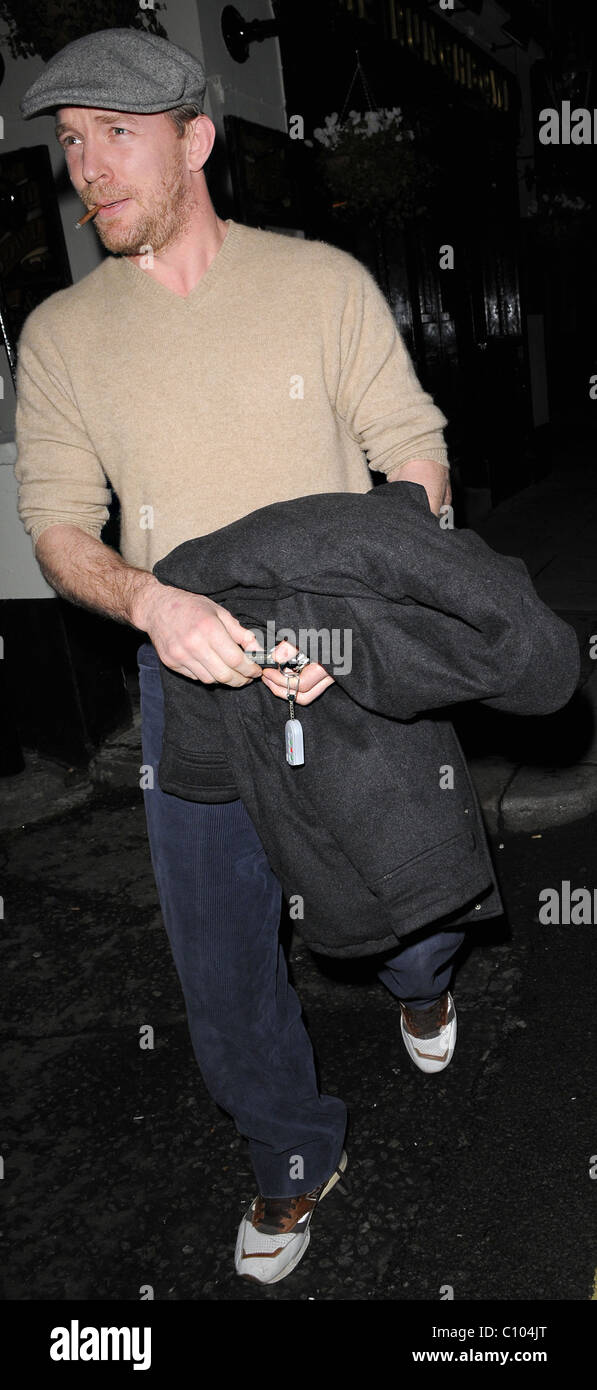 Guy Ritchie leaves his Punch Bowl in Mayfair alone, smoking a roll up