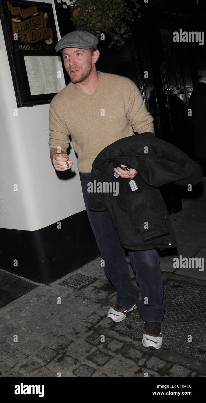 Guy Ritchie leaves his Punch Bowl in Mayfair alone, smoking a roll up