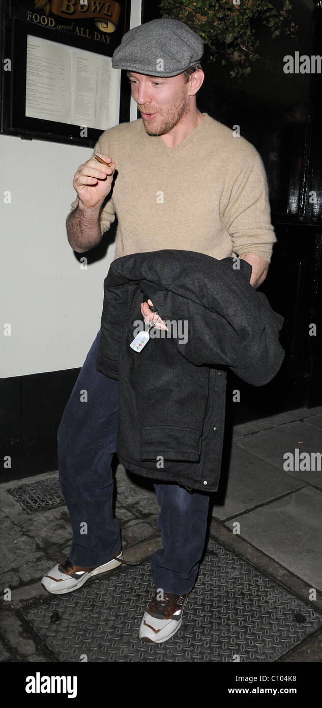 Guy Ritchie leaves his Punch Bowl in Mayfair alone, smoking a roll up