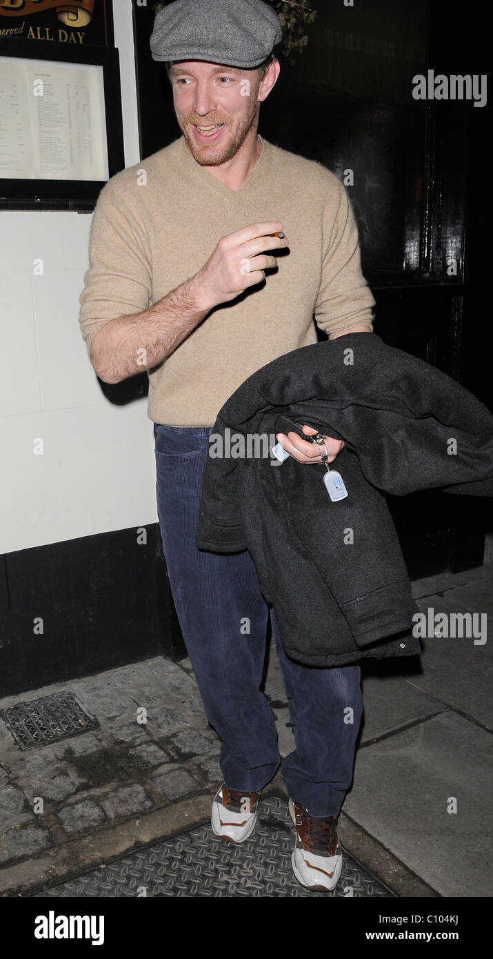 Guy Ritchie leaves his Punch Bowl in Mayfair alone, smoking a roll up