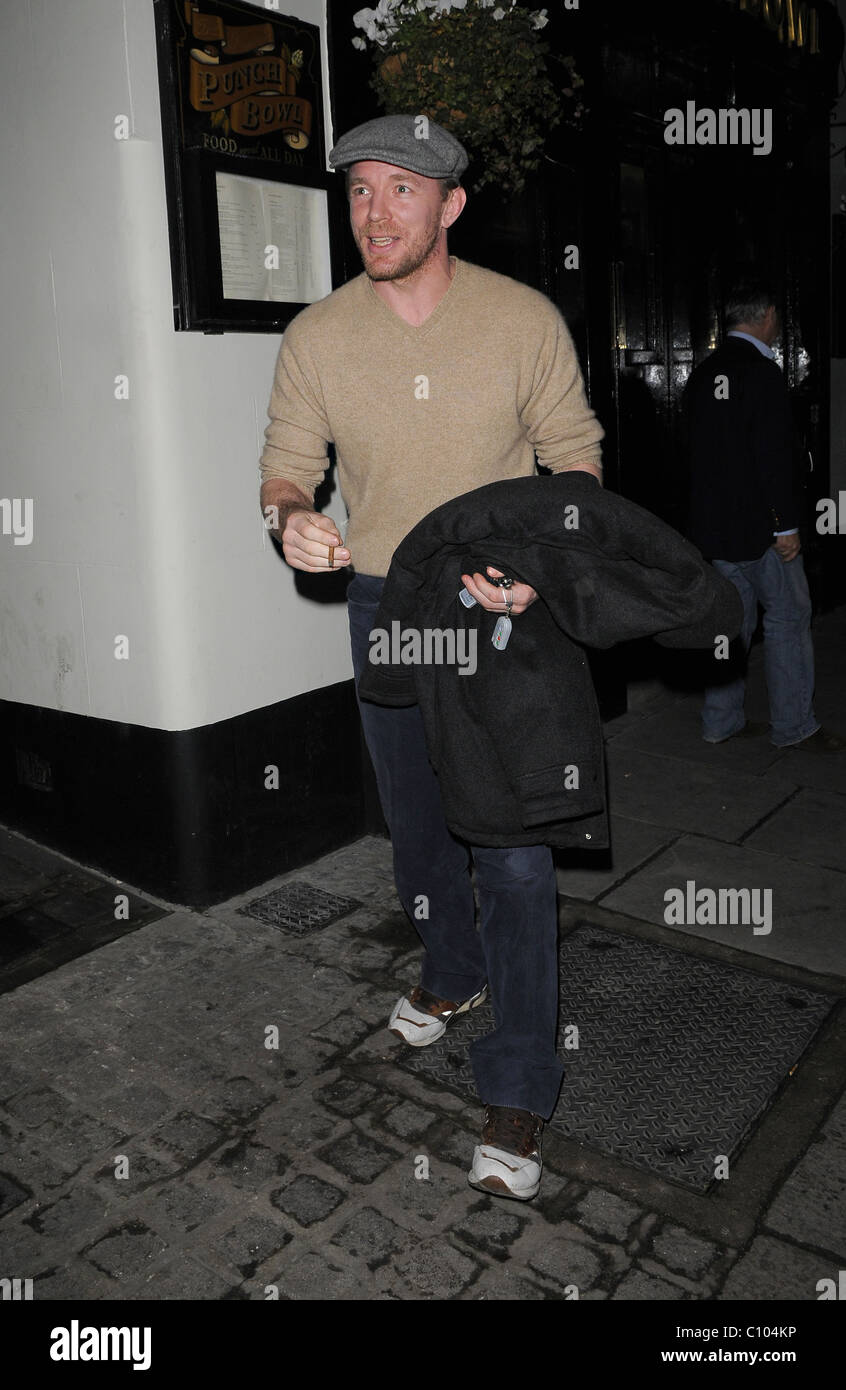 Guy Ritchie leaves his Punch Bowl in Mayfair alone, smoking a roll up
