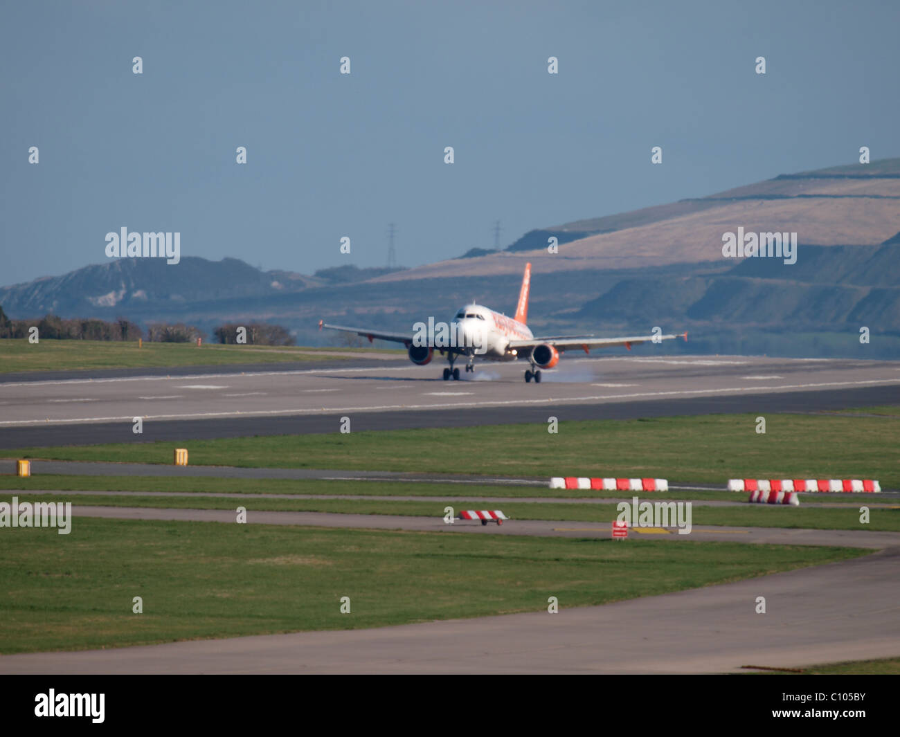 Easyjet plane landing at Newquay airport, Cornwall, UK Stock Photo