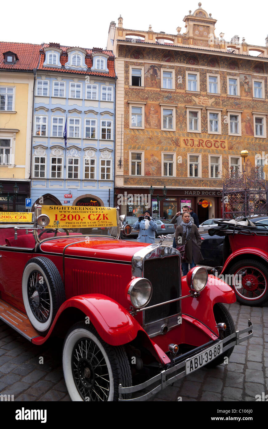 A red vintage car providing city tours Stock Photo - Alamy