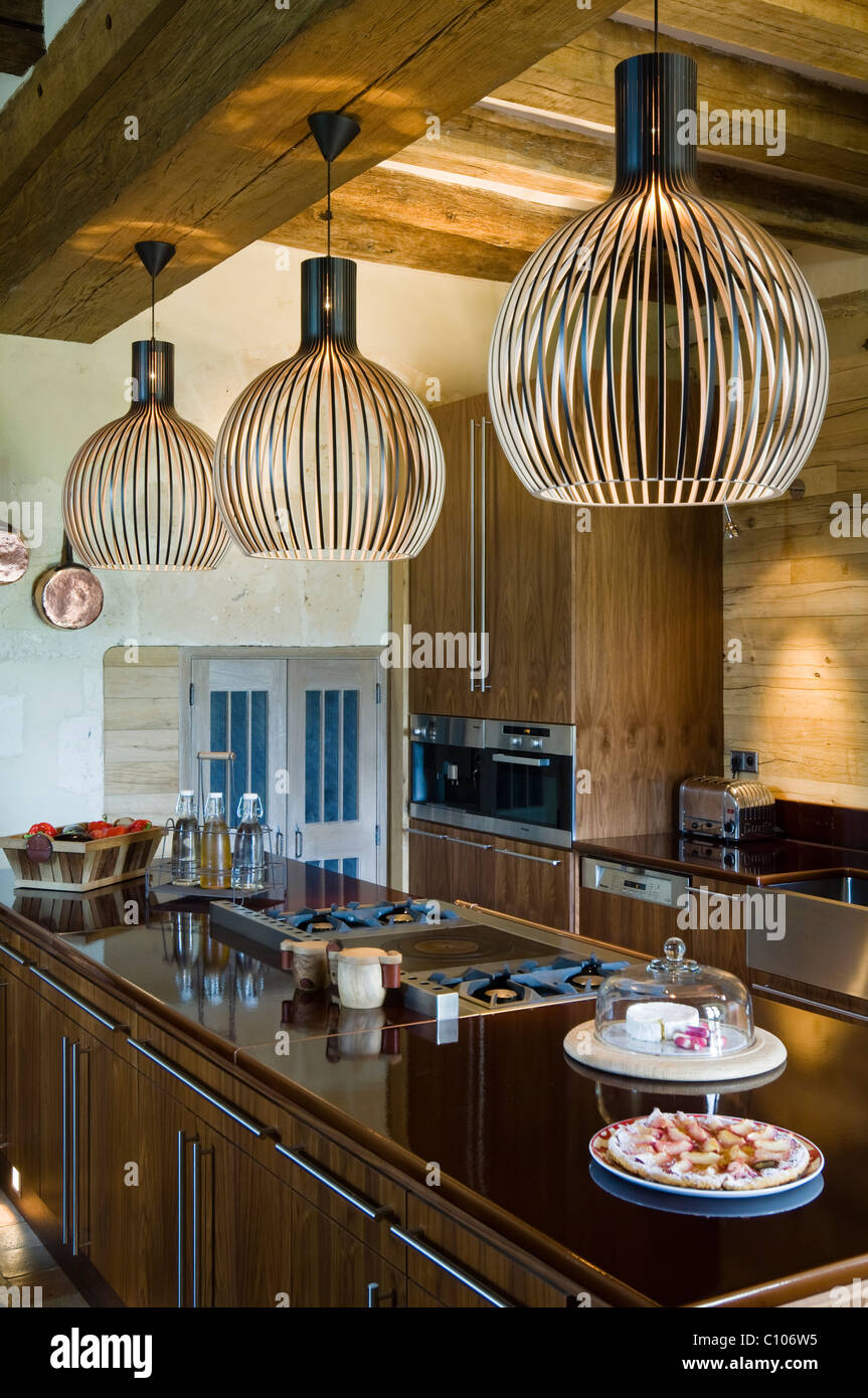 Secto Lamps In Kitchen With Beamed Ceiling And Asselin Birch Worktop Stock Photo Alamy