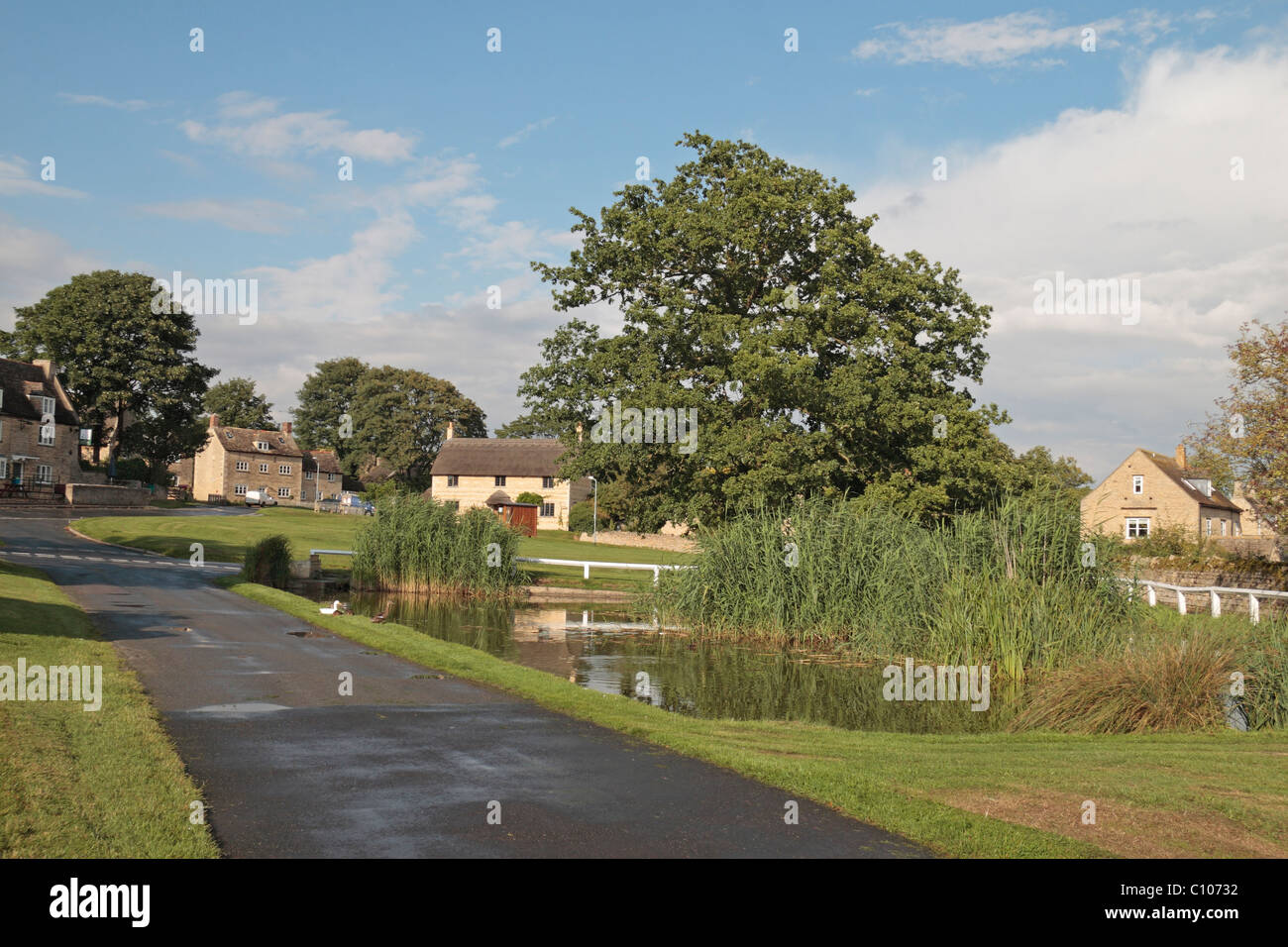 The village pond and green in the pretty village of Barrowden, Rutland, East Midlands, England, UK. Stock Photo