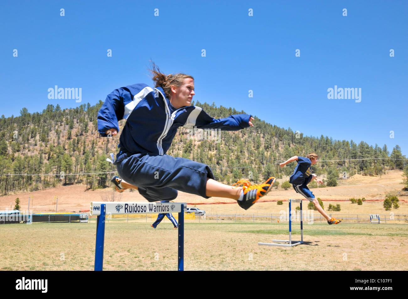 Teenage high school athletes warm up to participate in the athletic