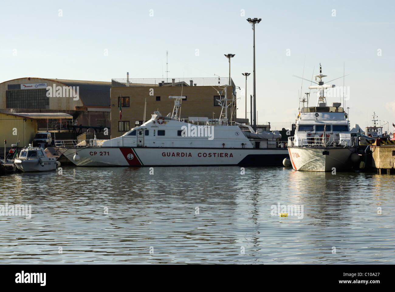 Guardia Costiera (coast guard) boat in Fiumicino canal harbour Stock Photo