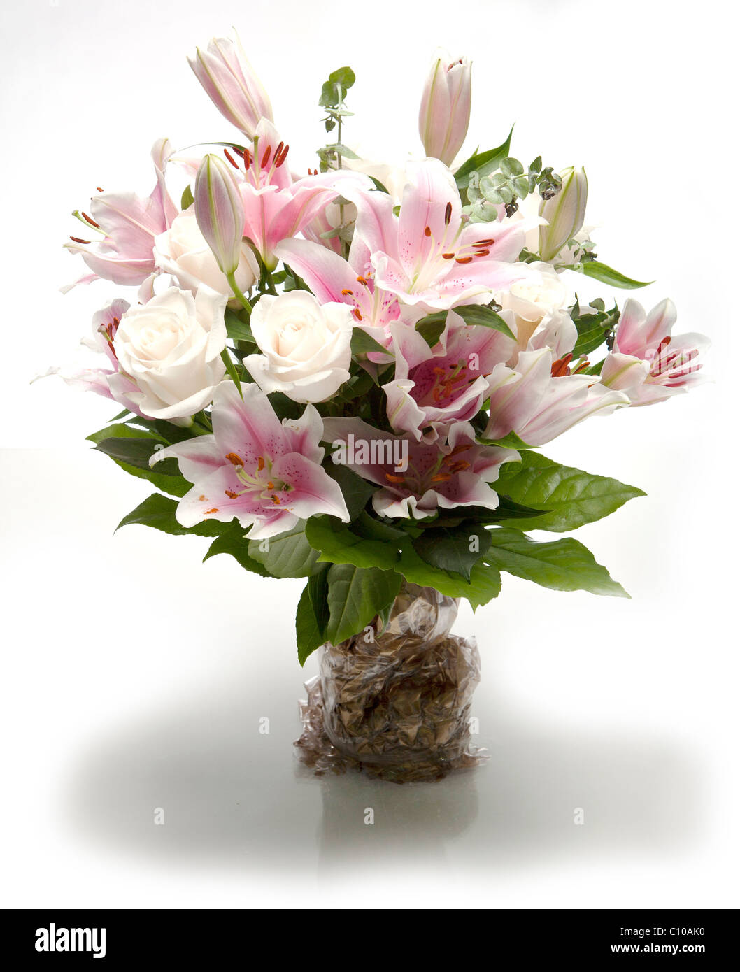 A photograph of a bouquet of flowers together, including white roses