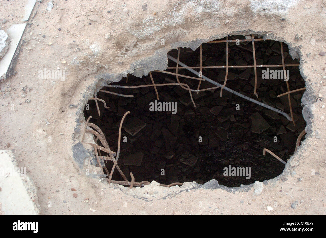 a hole made by a smart bomb in a block of flats when throw 6 floors