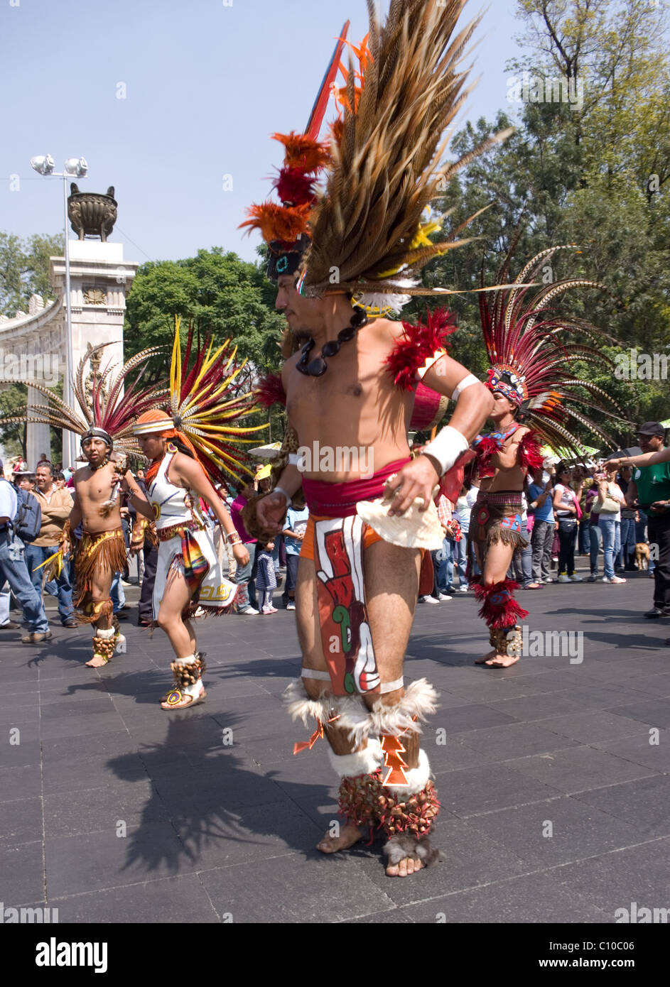 Prehispanic (Aztec) dance group performing during a parade in Mexico city Stock Photo
