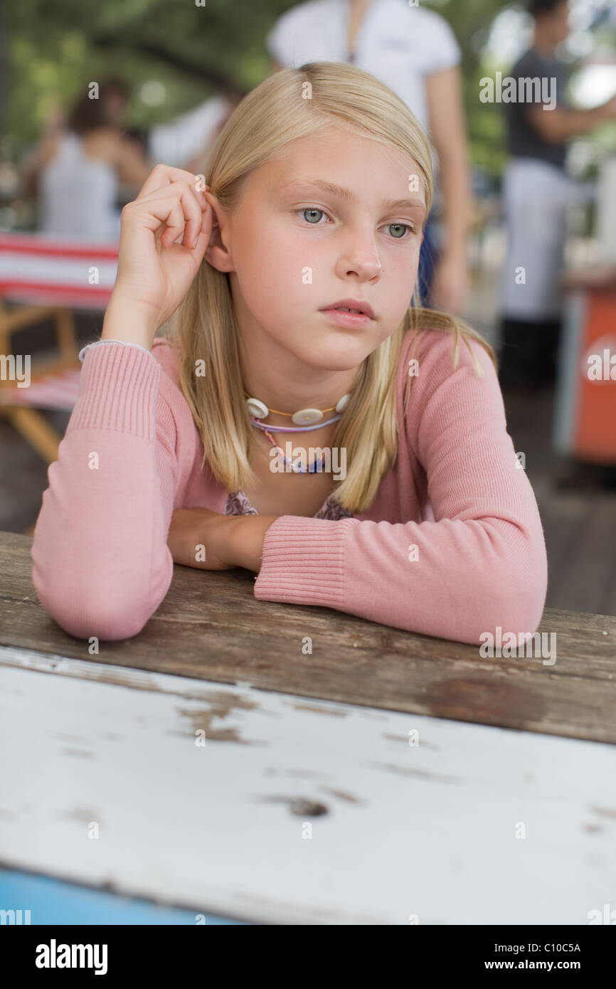 Closeup of blond haired girl looking serious Stock Photo